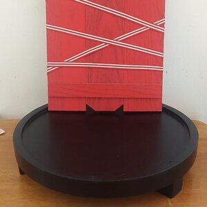 Wooden Black Rounded Table and Red Wooden Picture Frame